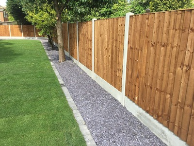 Wooden Fence post with concrete posts 